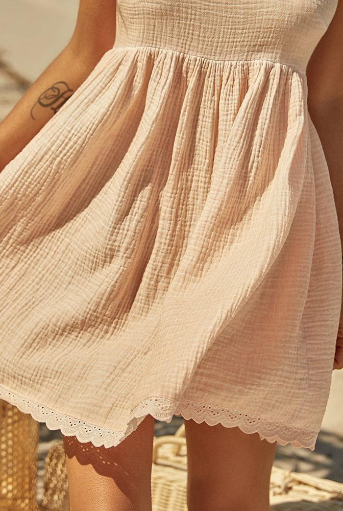 Pia - a dress in peach shade, made of natural fabric