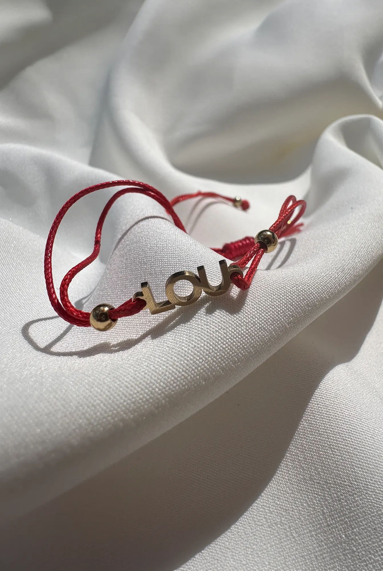 Lou bracelet on a red strap