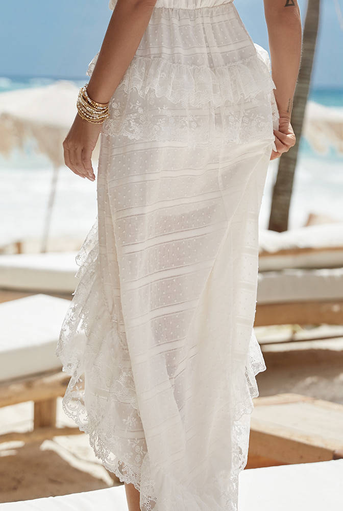 Coco - a maxi dress in a cream shade with frills