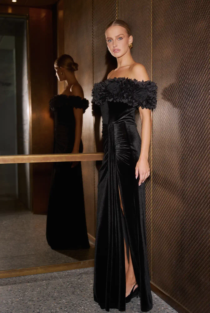 																							Klaudia – black maxi dress with floral embellishment
																					