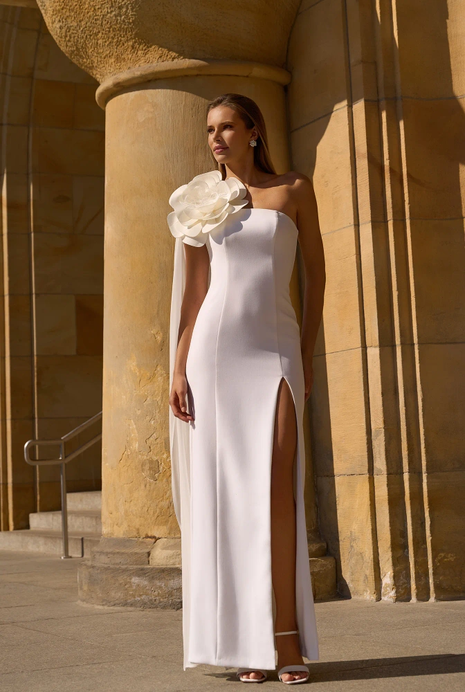 																							Lilianna - asymmetrical wedding dress with decorative flower
																					